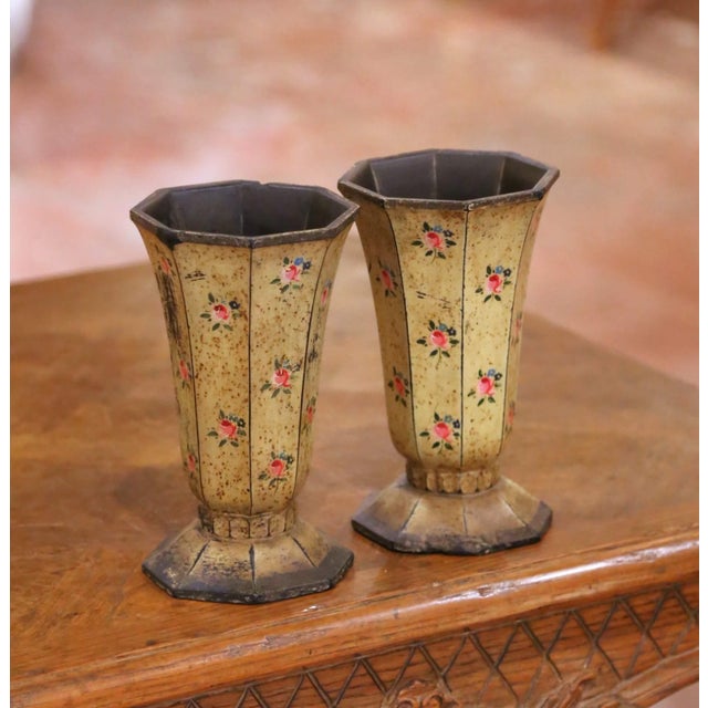 Bring a touch of French country charm to a mantel, console, or tabletop with this delightful pair of antique flower vases....
