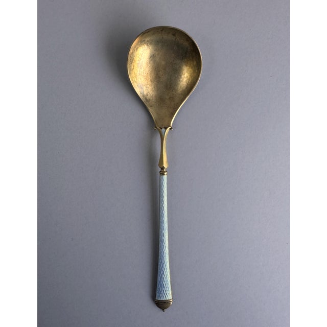 A rare and distinguished large serving spoon by David-Andersen of Oslo, Norway, one of Scandinavia's most celebrated...