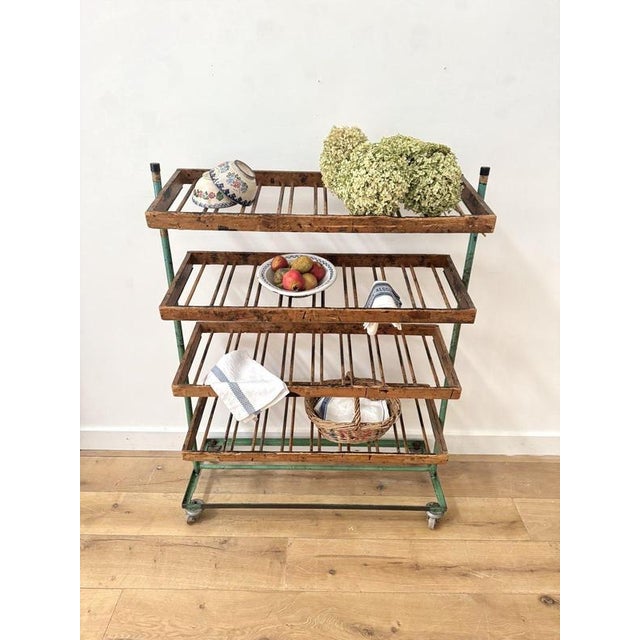 A fabulously original mid century shoe rack trolley recently salvaged from a show making factory in the midlands. with...