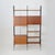 Italian modular shelving system from the 1950s, defined by vertical wooden uprights supporting suspended storage units and...