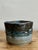 This evocative vintage studio pottery bowl is a masterclass in organic form and tactile design. Hand-thrown and then...