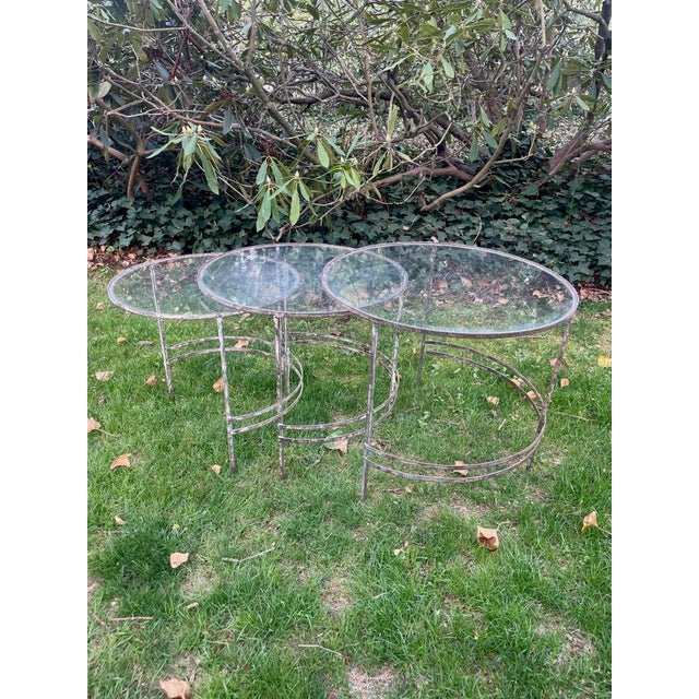 In the style of Eileen Grey or Warren McArthur these nesting tables are the essence of Art Deco chic. They are circular on...