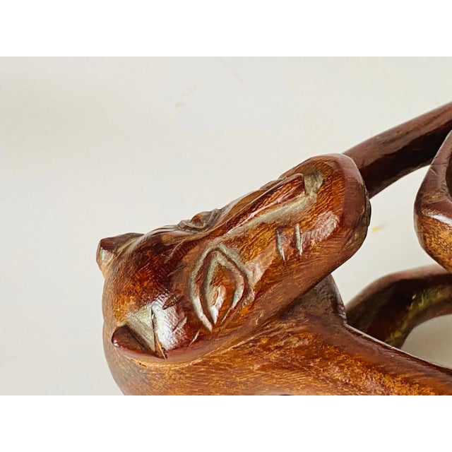 African Vide Poche and sculpture, with Animals holding a bowl in wood, 1960 Sculpture in wood.