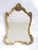 A stunning gold gilt scalloped French baroque style mirror from the 70's. It has a wonderful carved frame. The mirror is...