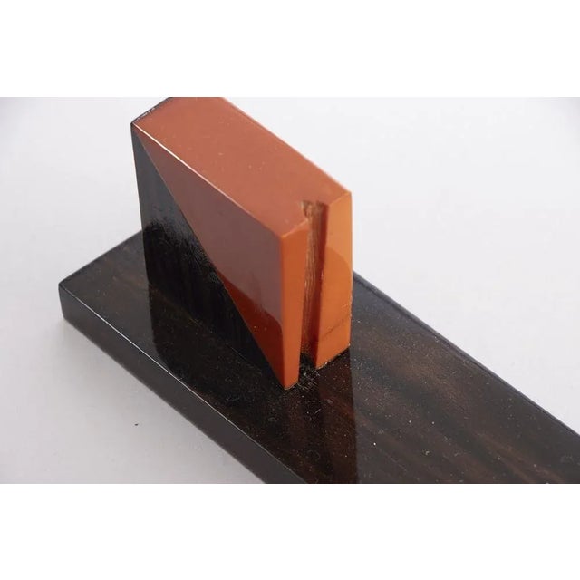 H: 27cm w: 32cm d: 6.5cm a pair of french art deco photo frames made in amber phenolic and macassar circa 1930s.