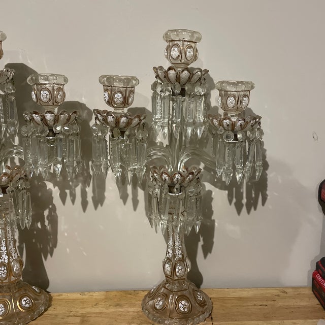 Pair of French Baccarat crystal candelabras, 19th Century, three lights with two scrolled arms featuring hand painted...