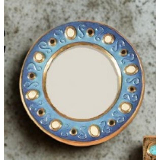Round glazed ceramic wall mirror by the French ceramicist Francois Lembo, Vallauris, circa 1970s. The circular frame is...
