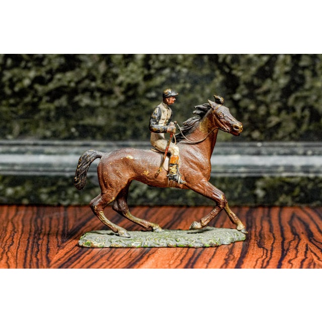 A striking example of 19th-century Austrian craftsmanship, this cold-painted bronze sculpture captures a polo player mid-...