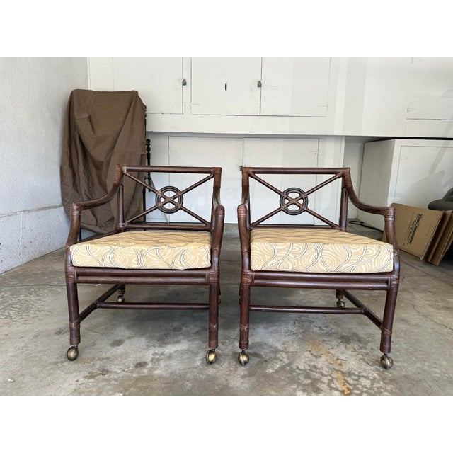 A beautiful pair of McGuire Target Back lounge chairs on casters. Purchased new in 2000. Two pairs and a single are...