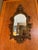 Antique Italian hand-carved gilt-wood patinated mirror in the Baroque style. Intricate high-relief carvings of leaves,...