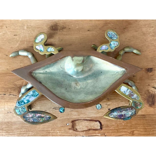 This enchanting vintage crab-shaped bowl is a standout example of mid-century Mexican artisan metalwork. Hand-crafted from...