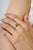 Crafted in 925 sterling silver, this elegant cluster ring features octagon and marquise-cut emeralds totaling 0.77 carats,...