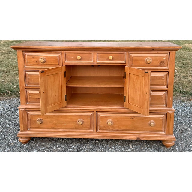 Charming farmhouse style rustic pine dresser with 9 dovetailed drawers and storage cabinet. Natural stripped pine look...