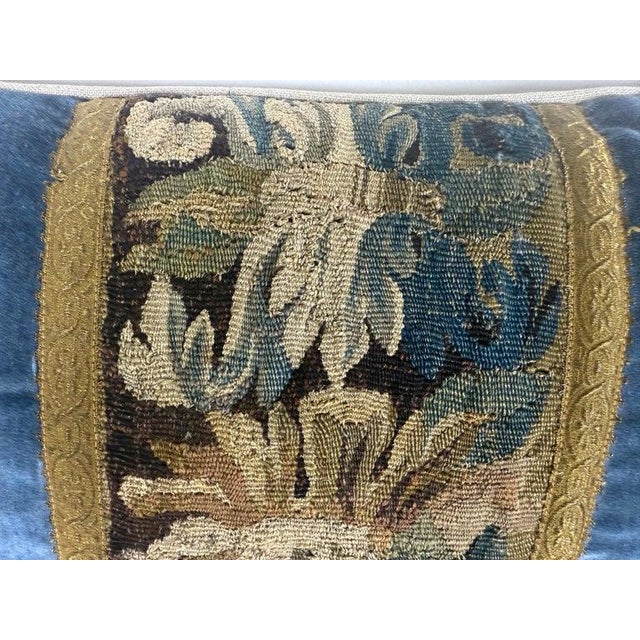 A richly textured pair of decorative pillows created from fragments of 18th century French tapestry, thoughtfully...