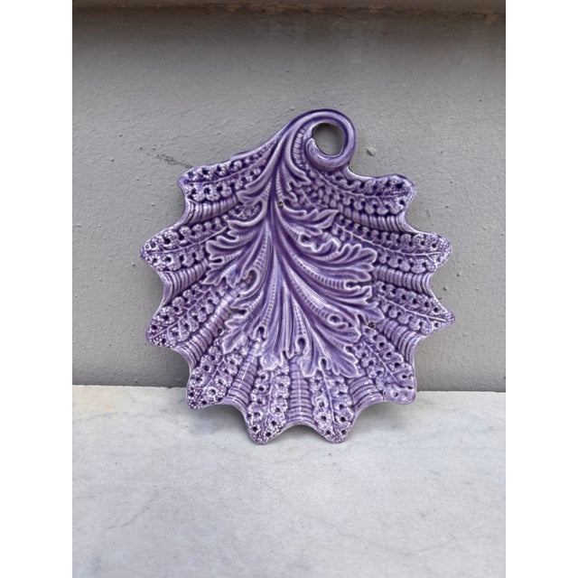 Rare French Majolica purple dish with a curled leaf-stem handle signed Onnaing Mouzin, circa 1890.