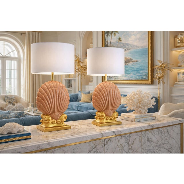 Offering a restored vintage pair of seashell table lamps, Late 20th Century. These gorgeous lamps were completely...