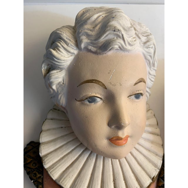 A really marvelous set of two painted bas relief women's heads, probably chalk ware. They can be leaned or laid flat.