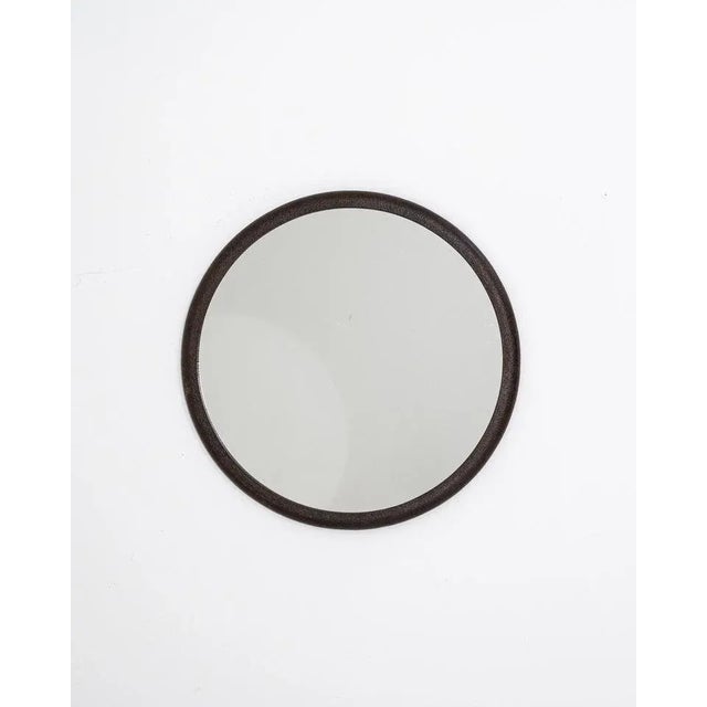 A polish iron mirror created in the 1950s. Simple yet elegant, this circular mirror offers unique Industrial charm. Its...