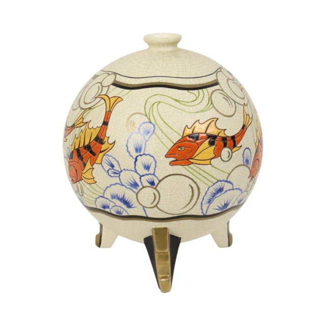 Very rare bulbous vase with a crackle effect and colorful fish decoration on a cream or beige background. This vase was...