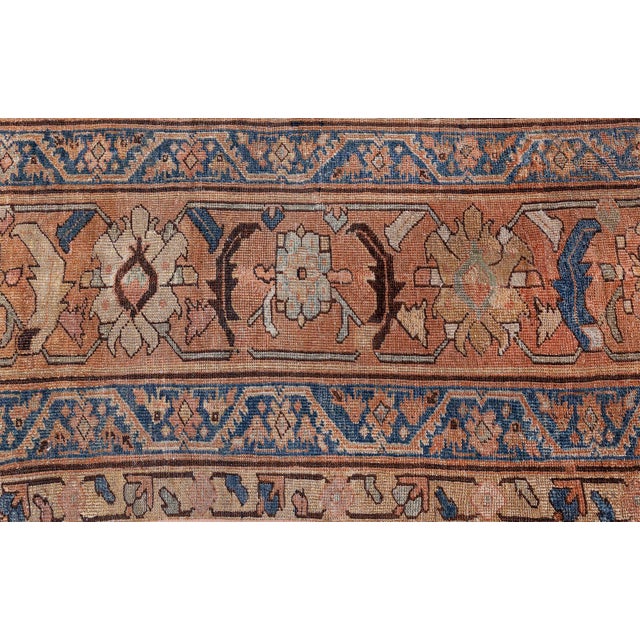 A late 19th century Persian Mahal (Mohal) antique sultanabad rug, the midnight blue field with a angular flowering vine...