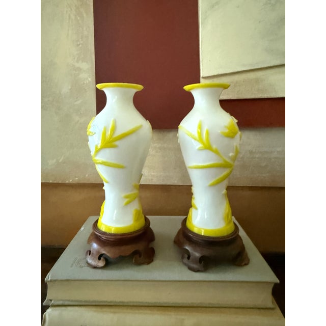 Chinoiserie Pair of Mid-Century Peking Glass Vases With Carved Yellow Floral and Butterfly Motif | Chinese Overlay Glass on Wood Stands For Sale - Image 3 of 10