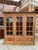 This antique cherry wood bookcase has been fully restored. It features 3 large lockable glass doors opening onto 4 shelves...