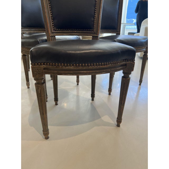 These 6 Louis XVI chairs have clean and understated silhouettes with straight legs and a tapered back. They are...