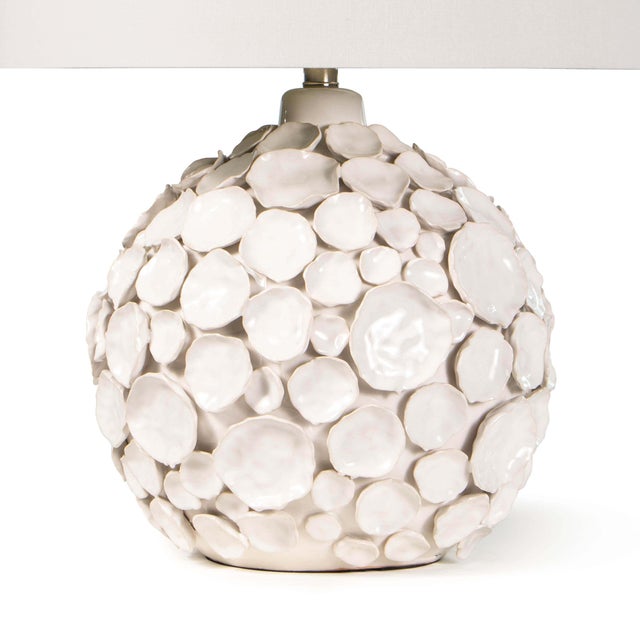 Organically shaped and glazed in various tones the Lucia lamp is reminiscent of the beach. Multiple hand-crafted, pinched...