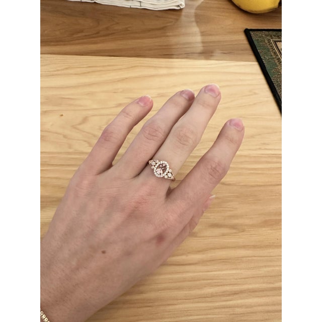 This gorgeous ring features a 0.62 carat oval pink morganite gemstone with milgrain details and natural earth-mined...