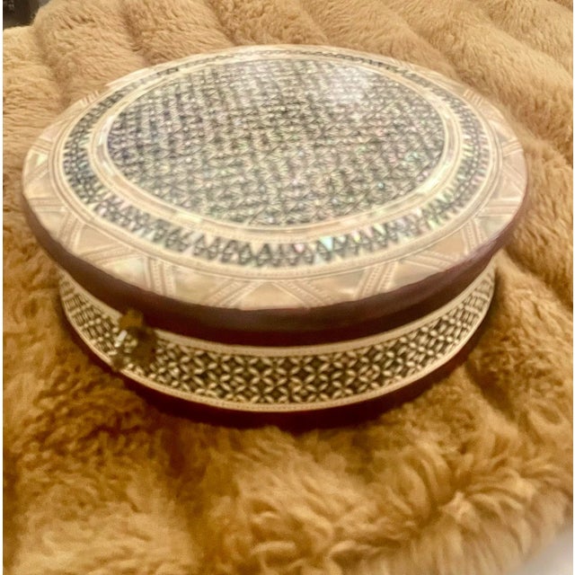 Vintage, Mid 20th Century jewelry or keepsake box inlaid with mother-of-pearl. Handcrafted by artisans. The intricate...