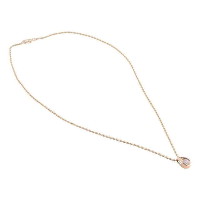 This is part of Chairish’s Fine Jewelry assortment. Estate diamond teardrop pendant on chain. This 14 karat yellow gold...