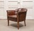 Elegant and refined Swedish “Tiger” club chair from the 1920s, executed in rich dark brown leather. This slender model...