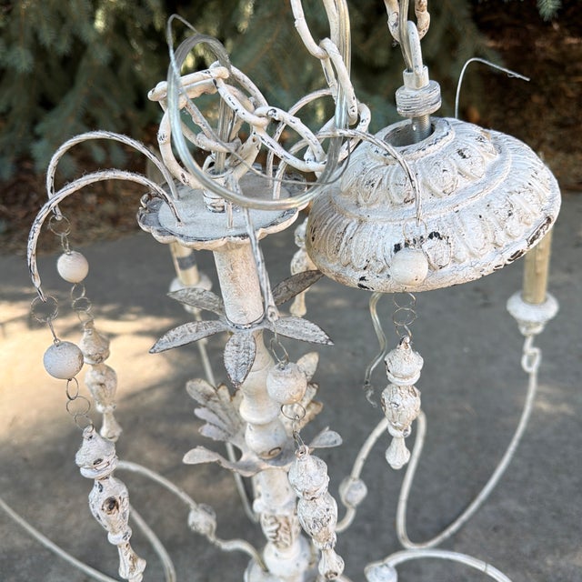Elegant and romantic, this French Country-inspired chandelier brings timeless European charm to any interior. Featuring a...