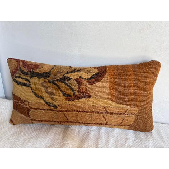 Dating from the 18th century, this French tapestry pillow represents the transformation of an early woven furnishing...