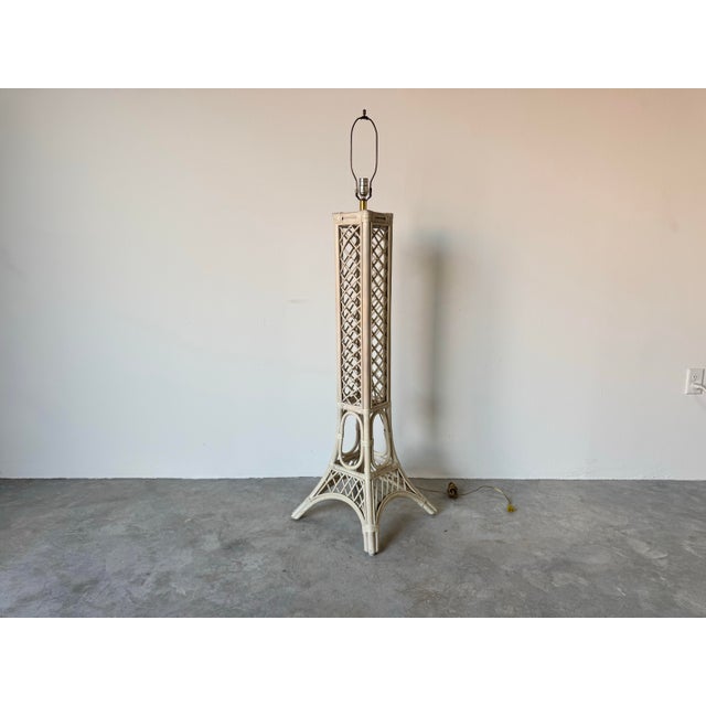 This unique vintage floor lamp is crafted from pencil reed rattan in the shape of the iconic Eiffel Tower. The intricate...