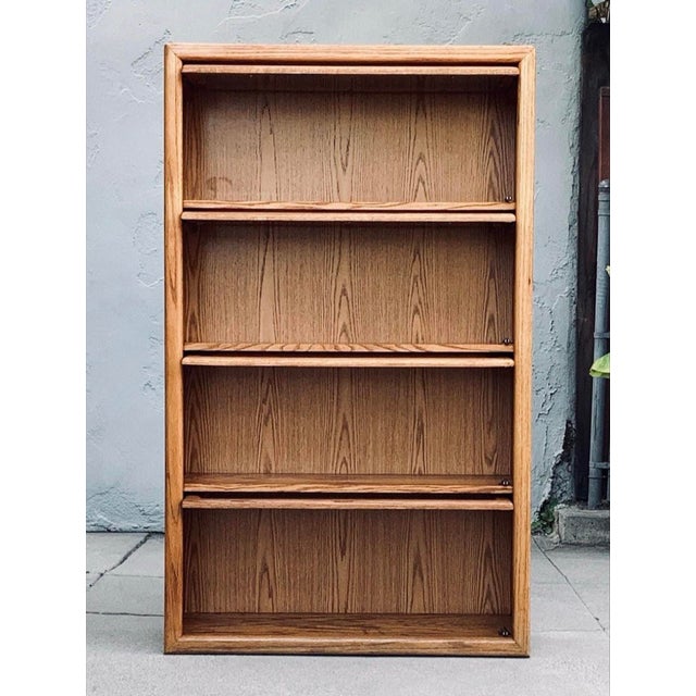 A refined early 20th-century oak lawyer’s bookcase, distinguished by its clean architectural lines, warm golden patina,...