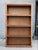 A refined early 20th-century oak lawyer’s bookcase, distinguished by its clean architectural lines, warm golden patina,...