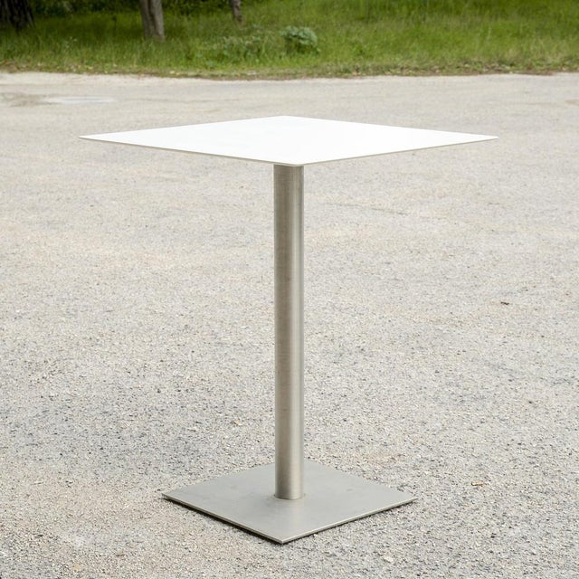 This steel outdoor high table is the perfect blend of industrial design and contemporary functionality. Featuring a solid,...