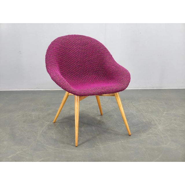 Mid-century modern shell lounge chair designed by Miroslav Navrátil in 1960s Czechoslovakia. This iconic design features a...