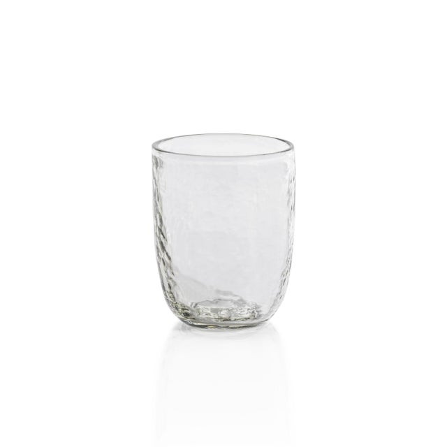 Serve your favorite drinks in style with this set of four Hammered Tumblers. Crafted from glass in a clear finish, these...