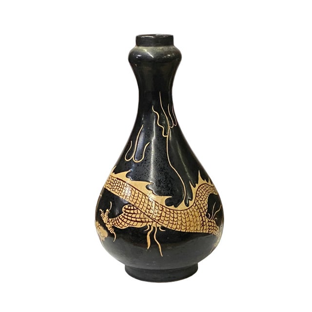 This is a handmade Chinese accent decorative art made of ceramic in brown-black mix color and cream tan color dragon...