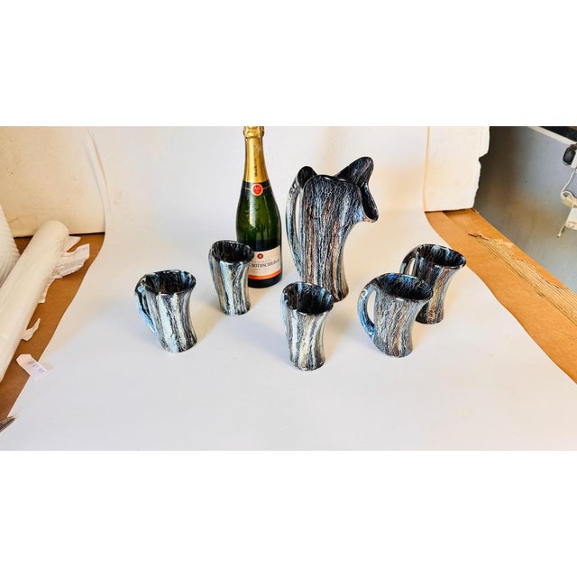 1960s ceramic orangeade set with pitcher and mugs, freeform design, vallauris style this stunning 1960s ceramic orangeade...