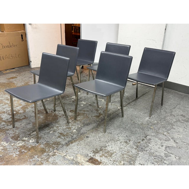 Design Plus Gallery presents a Set of Six Phoenix Carbon Grey Dining Chairs from CB2. Upholstered in carbon grey with a...