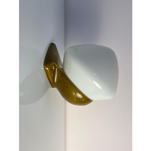 This exceptional wall lamp, model 6030, is a design by Swedish designer Sigvard Bernadotte for the renowned manufacturer...