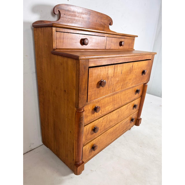 A wonderfully proportioned American Empire chest of two-over-four drawers in solid quilted tiger maple, ca. 1820s. From a...