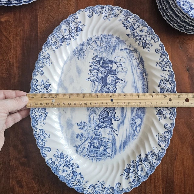 Add a touch of classic English charm to your table with this beautiful vintage Johnson Brothers *Coaching Scenes* oval...