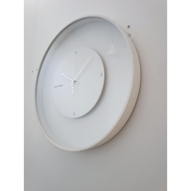 A very beautiful and substantial designer clock by Salt & Pepper. Belgium, circa 2000. White lacquered wood frame...