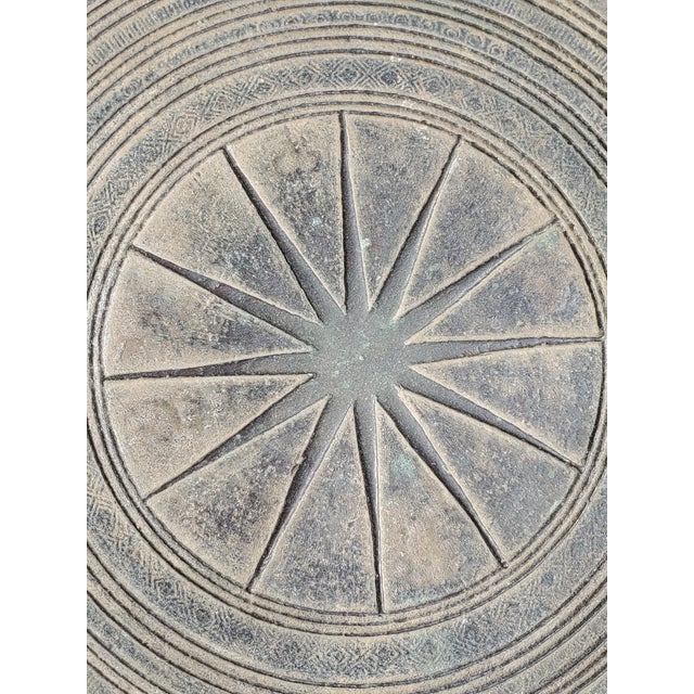 Purchased years ago in Asia, this is a beautiful example of a bronze rain drum. A collectors item but usuable in many ways...