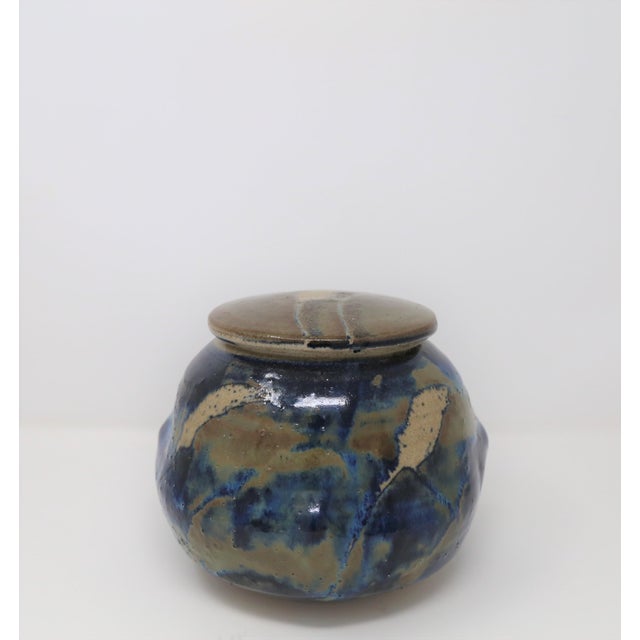 This stoneware vessel was designed by renowned Texas artist Ishmael Soto. It features tactile qualities in a masterfully...