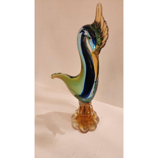 This listing features a Murano style glass crane